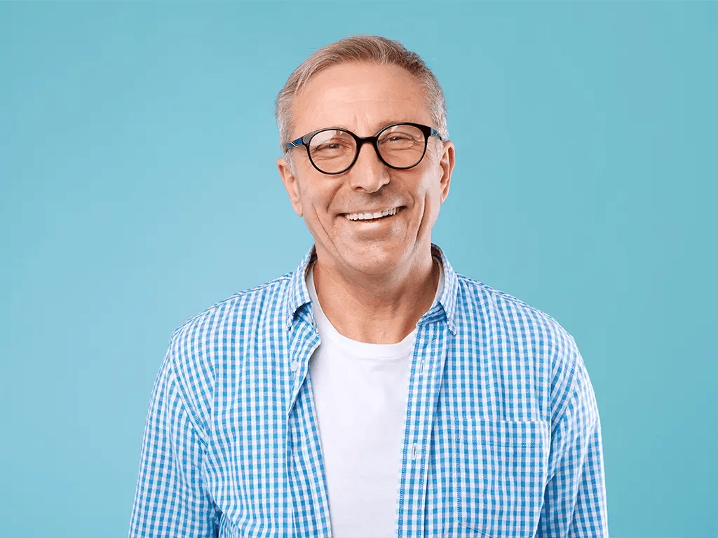 portrait of smiling man with glasses in studio portrait of smiling man with glasses in studio